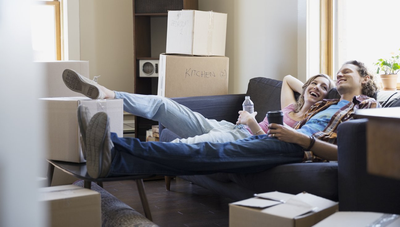 Happy Young Couple on a Sofa - WIlls & Estate Law